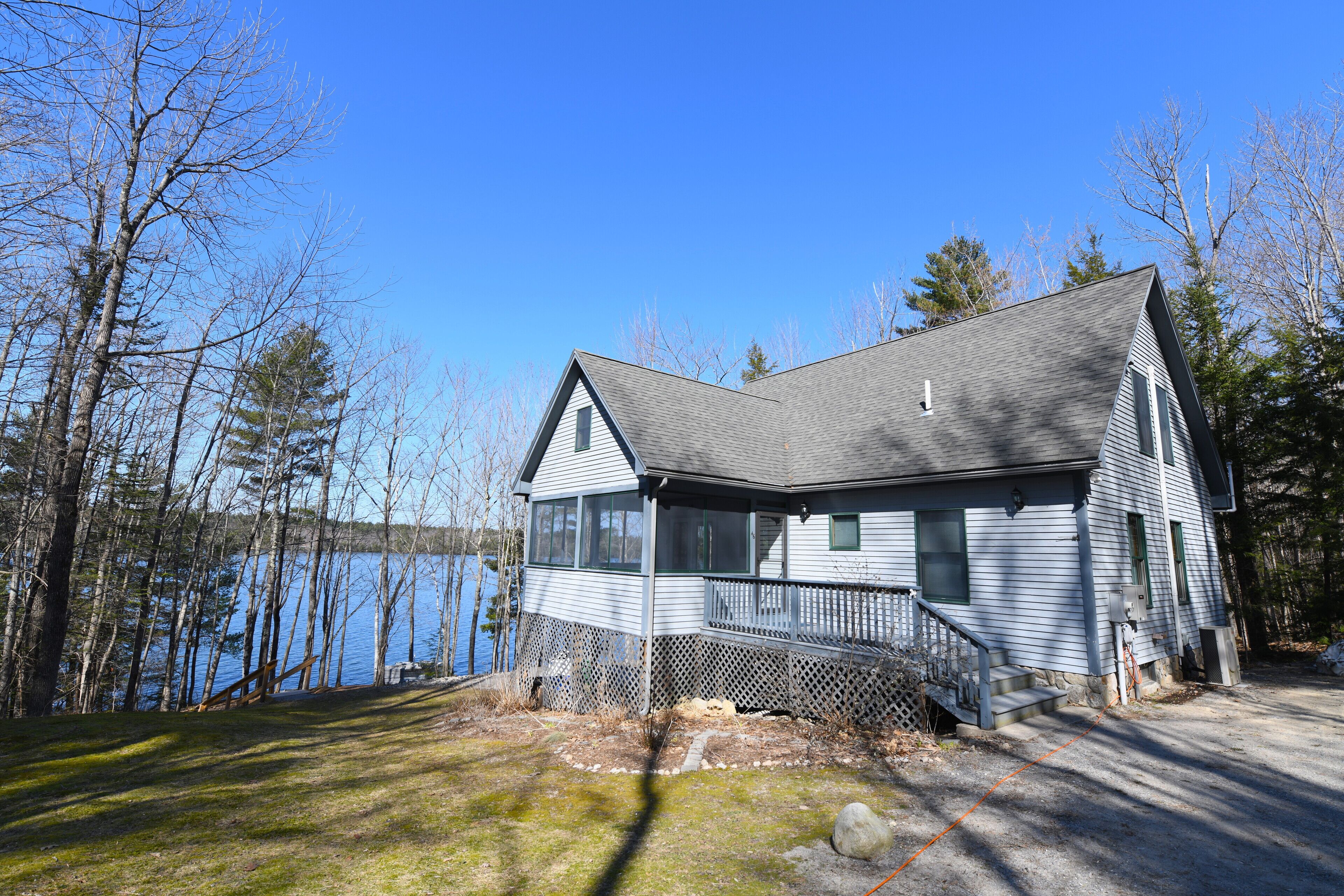Charming Cape with Wall of Windows facing Pleasant Lake for Sunset Views!