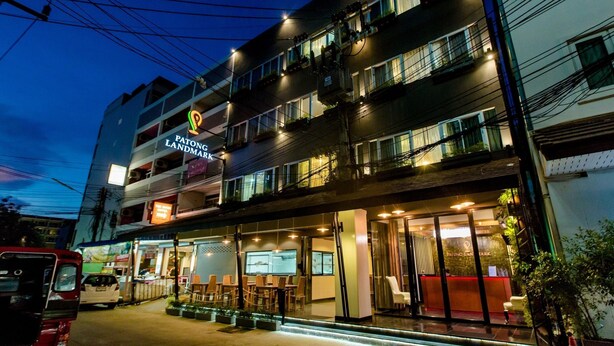 A multi-story hotel with a prominent sign for "Patong Landmark Hotel." - The Landmark Patong (Patong)