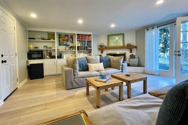 Living room with with lots of light and door onto the patio