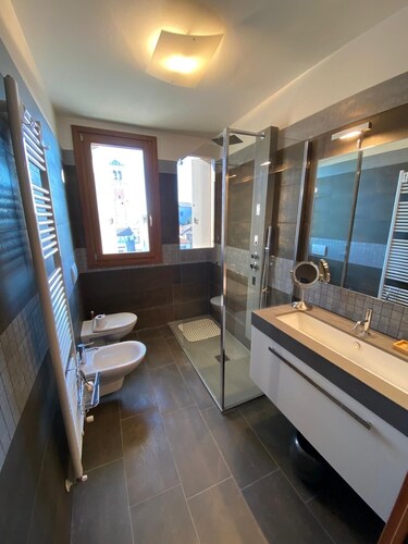 Fully furnished new top floor condo in the center of charming Aviano w/ terrace.