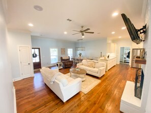 Relax in this inviting living area with a sofa, armchair, and coffee table.