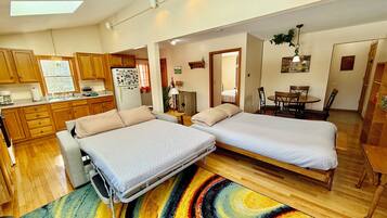 1 bedroom, desk, iron/ironing board, travel crib