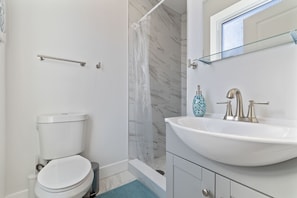 Shower, hair dryer, towels, soap