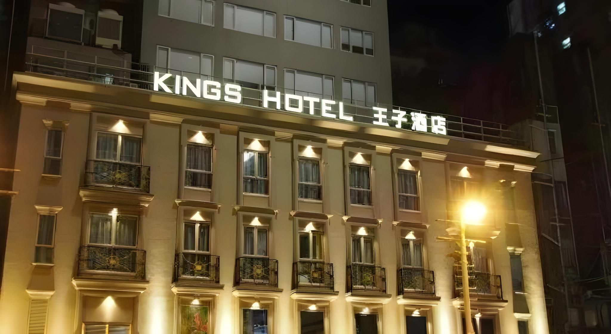 A multi-story building with the sign 'KINGS HOTEL' prominently displayed.