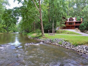Property grounds - Riverfront cabin with WiFi, 2 fireplaces, game room, pool table and hot tub. (Ellijay)