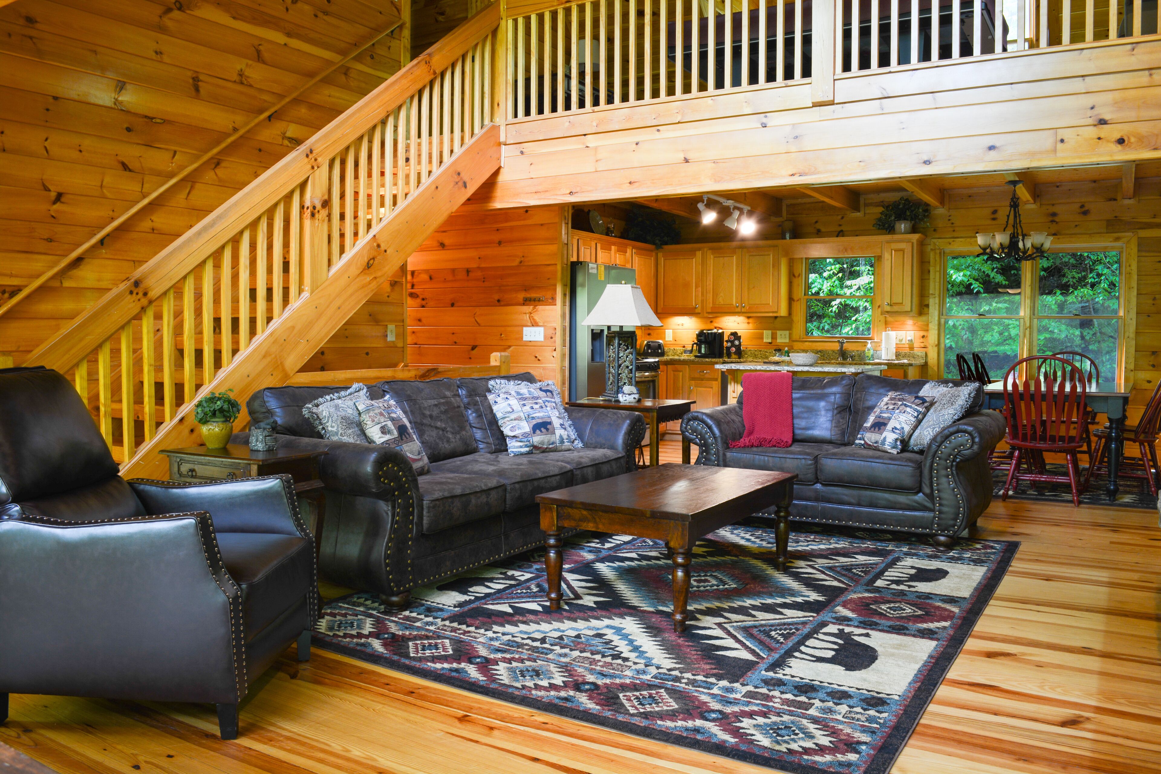 Riverfront cabin with WiFi, 2 fireplaces, game room, pool table and hot tub.