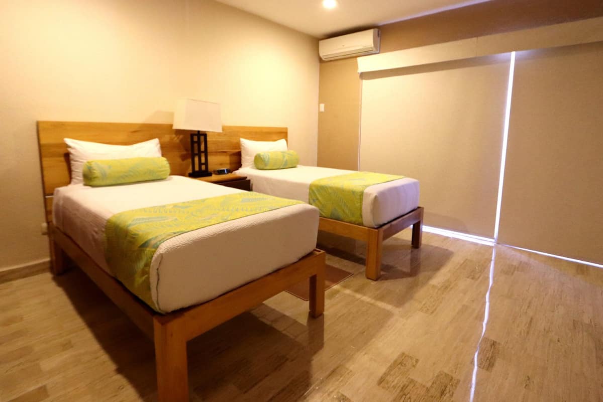 Family Condo, 2 Bedrooms, 2 Bathrooms, Lagoon View, Balcony | 2 bedrooms, in-room safe, free WiFi, bed sheets