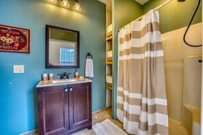 Shower, hair dryer, towels, toilet paper