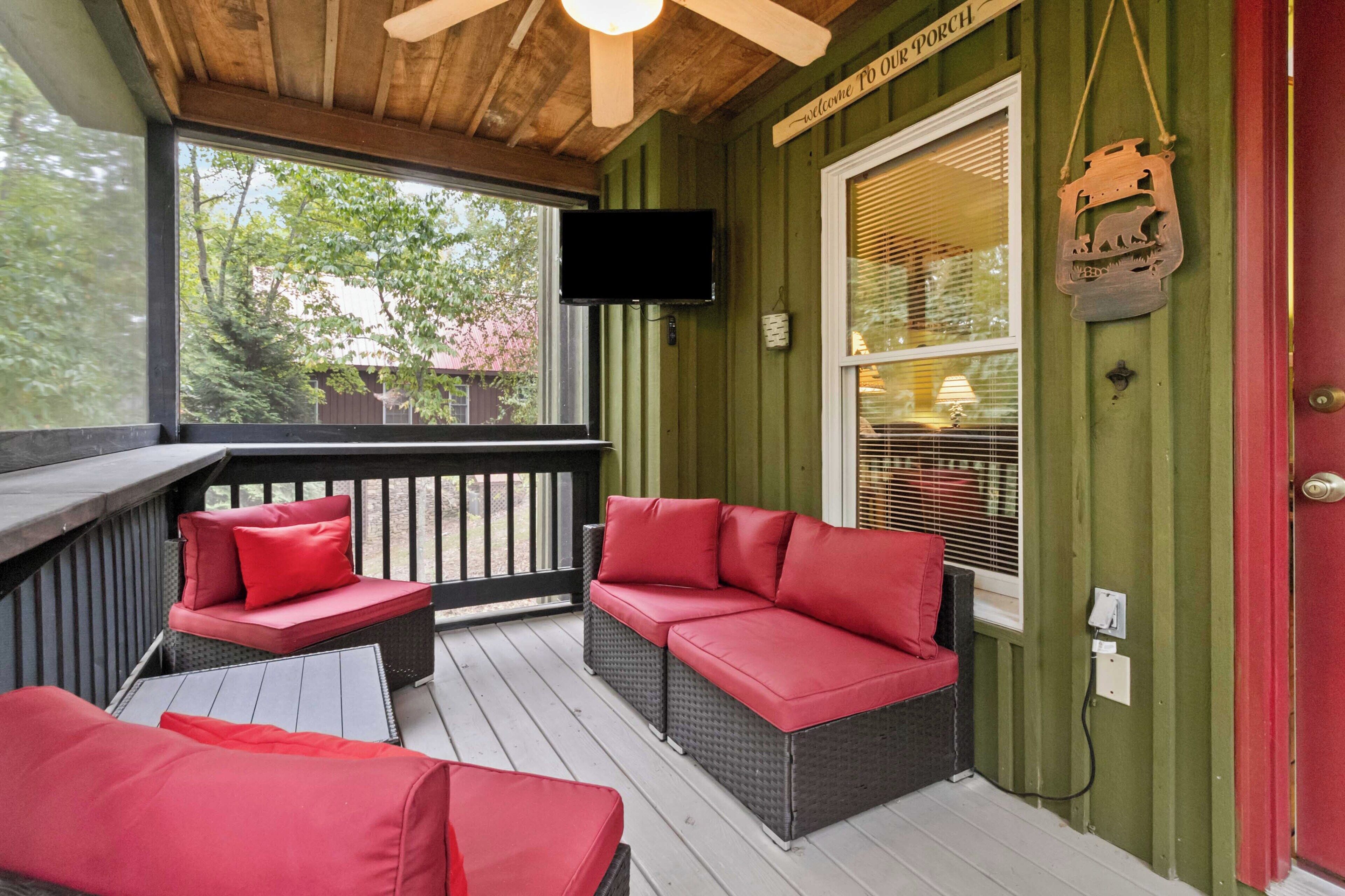 A porch with wicker furniture, a TV, and a sign that reads "Welcome to Our Porch."