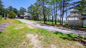 A rural road leading to a house with a gazebo and a small cabin. - Nuthouse - Pickle Ball, Firepit, mountain views (Sevierville)