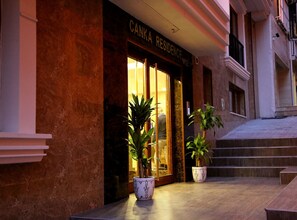 A hotel entrance with a sign reading "CANKA RESIDENCE." There are two potted plants in front of the entrance. - Canka Residence (Istanbul)