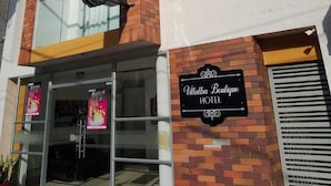 A hotel with a prominent sign reading "Villa Blanca Boutique Hotel" and a glass entrance. - Villalba Boutique Hotel (Valledupar)