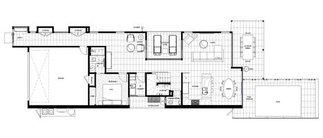 A floor plan of a hotel with a king-sized bedroom, a living room, a dining area, a kitchen, a bathroom, a garage, and a pool area.
