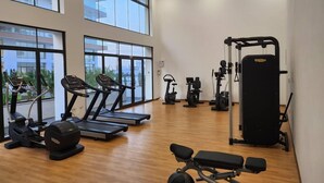 A gym with treadmills, elliptical machines, and weight equipment. - Elegant & Luxury Gem-5 Star Location -Pools, Gym! (Accra)