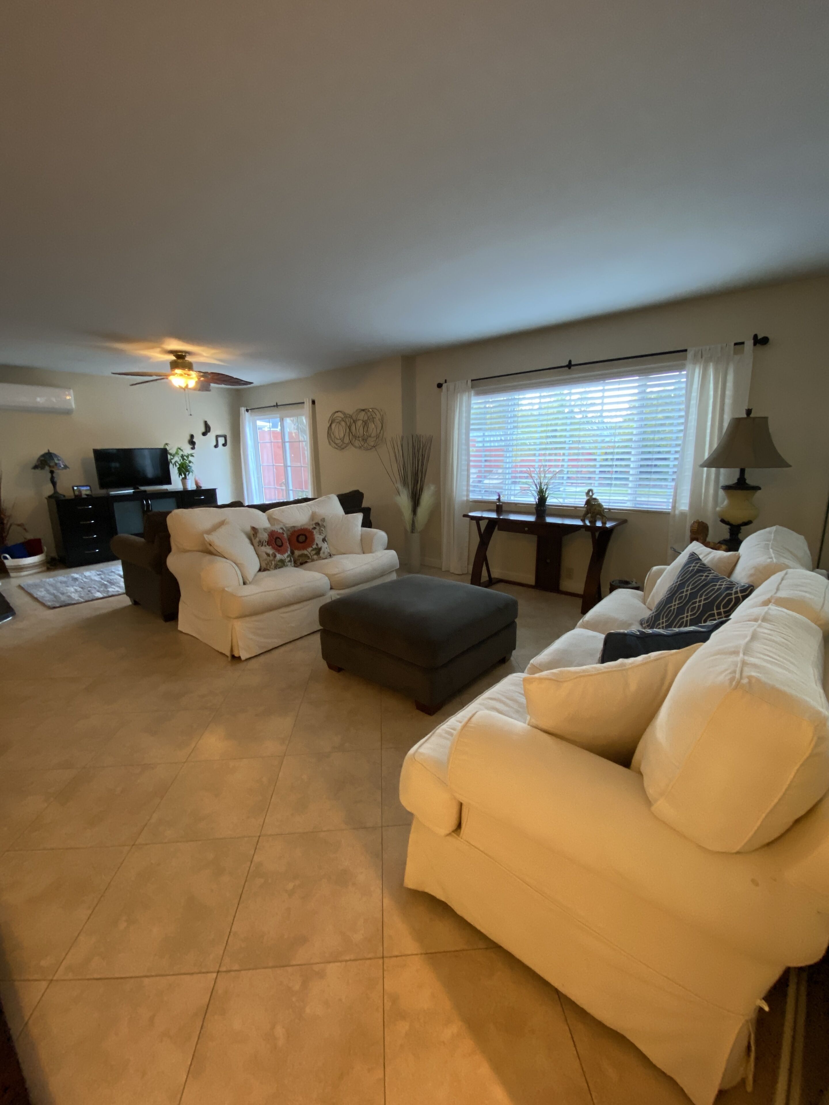 Mom's House is a one story house with a peaceful yard, pool and hot tub