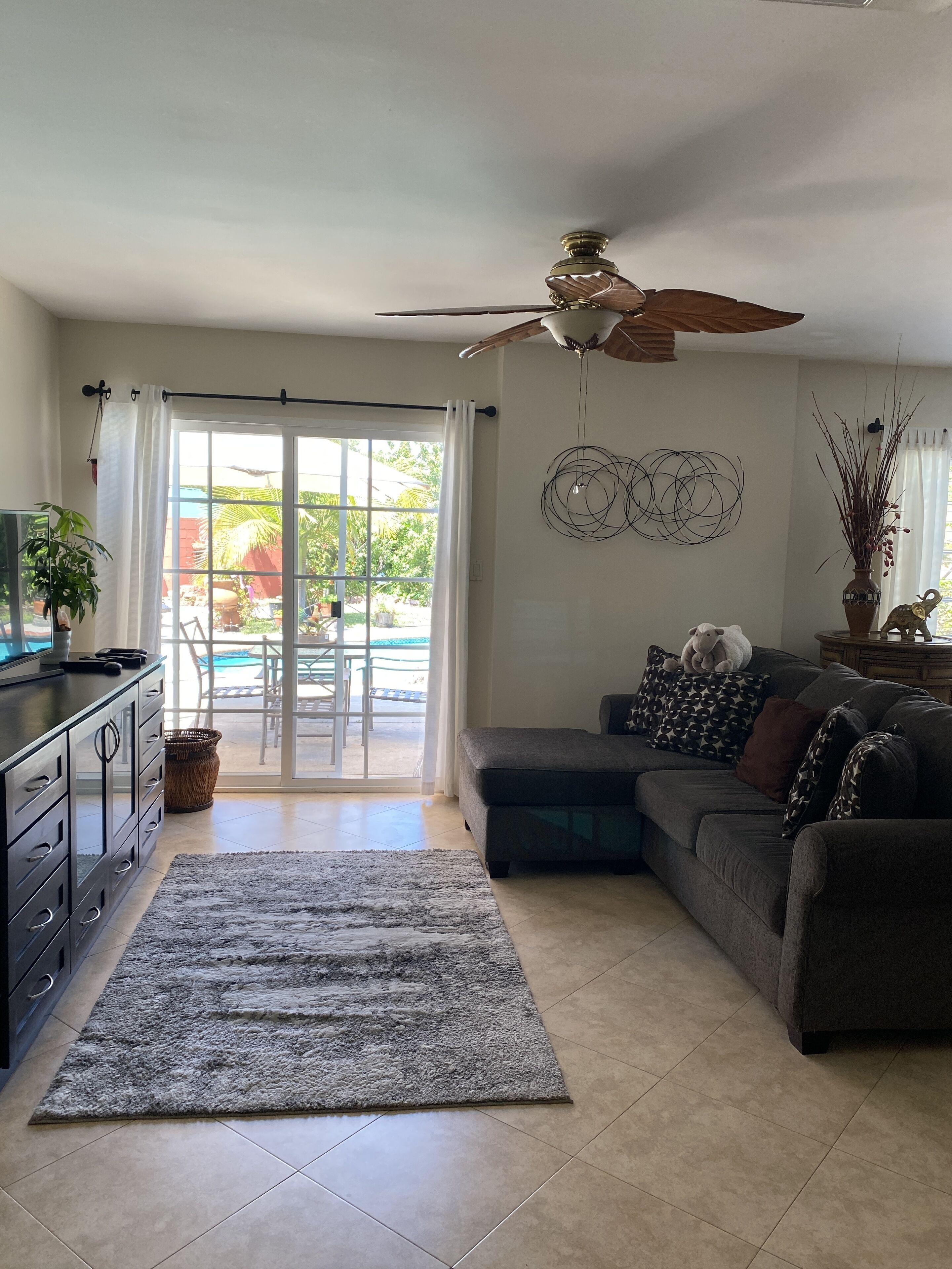 Mom's House is a one story house with a peaceful yard, pool and hot tub