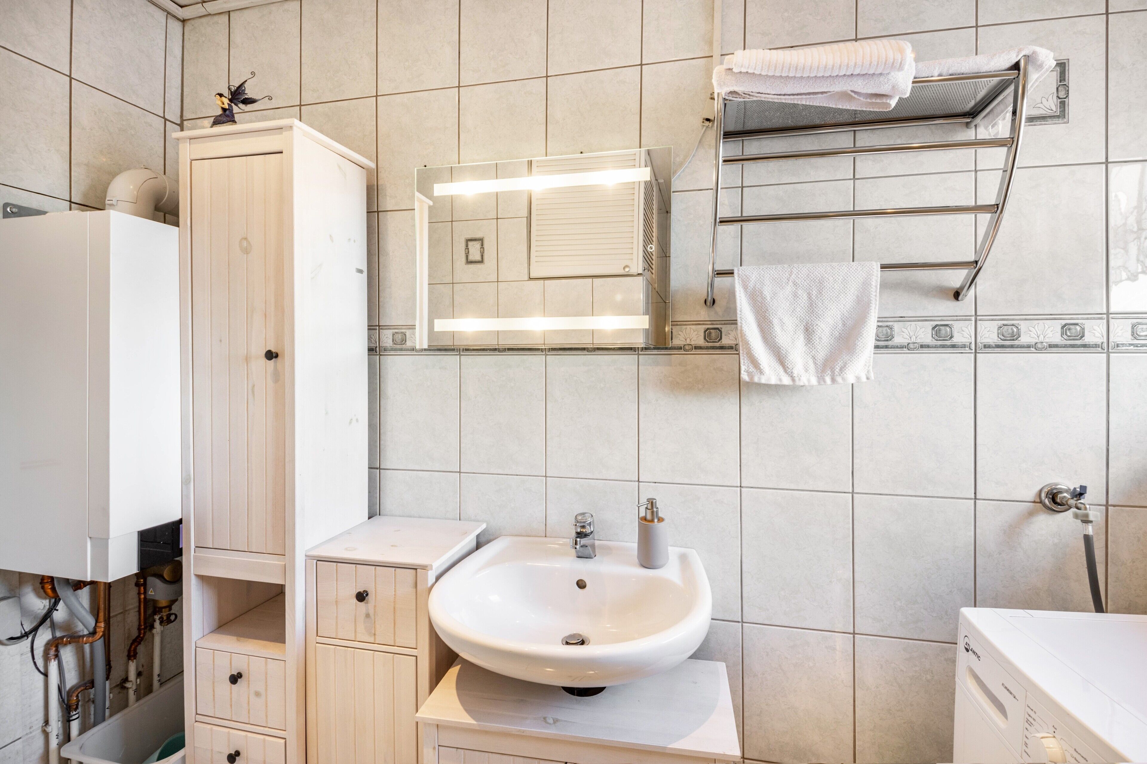 Bathtub, hair dryer, towels