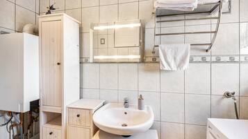 Bathtub, hair dryer, towels