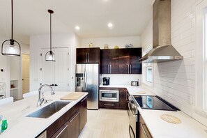 Fridge, microwave, oven, stovetop - Newly built home near beach and 30A with balcony, yard, patio, grill, & W/D (Santa Rosa Beach)