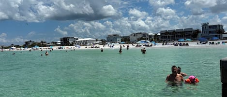 On the beach, sun loungers, beach towels