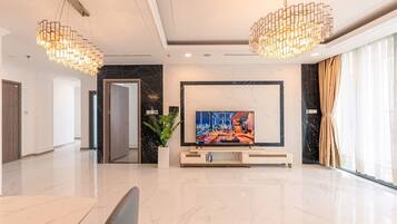 Deluxe Apartment, 4 Bedrooms, Balcony, River View | Living area | 32-inch Smart TV with digital channels, TV