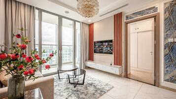 Deluxe Apartment, 2 Bedrooms, Balcony, City View | Living area | 32-inch Smart TV with digital channels, TV