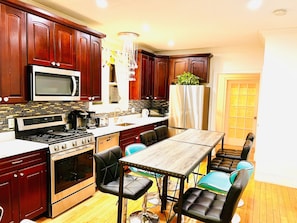 Fridge, microwave, toaster, cookware/dishes/utensils