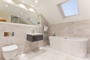 Bathtub, hair dryer, towels