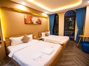 A hotel room with two beds, a painting on the wall, and a view through a window. - TEDDY 108 HOMESTAY & CAFE - GRAND WORLD PHU QUOC (Phu Quoc)