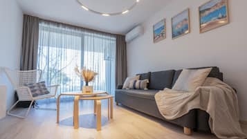 Standard Apartment, 2 Bedrooms | Living area | 100-cm Smart TV with digital channels, TV