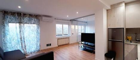 Deluxe Apartment, 1 Bedroom | Living area | Flat-screen TV