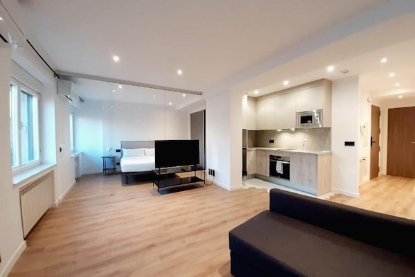 Deluxe Apartment, 1 Bedroom | Living area | Flat-screen TV