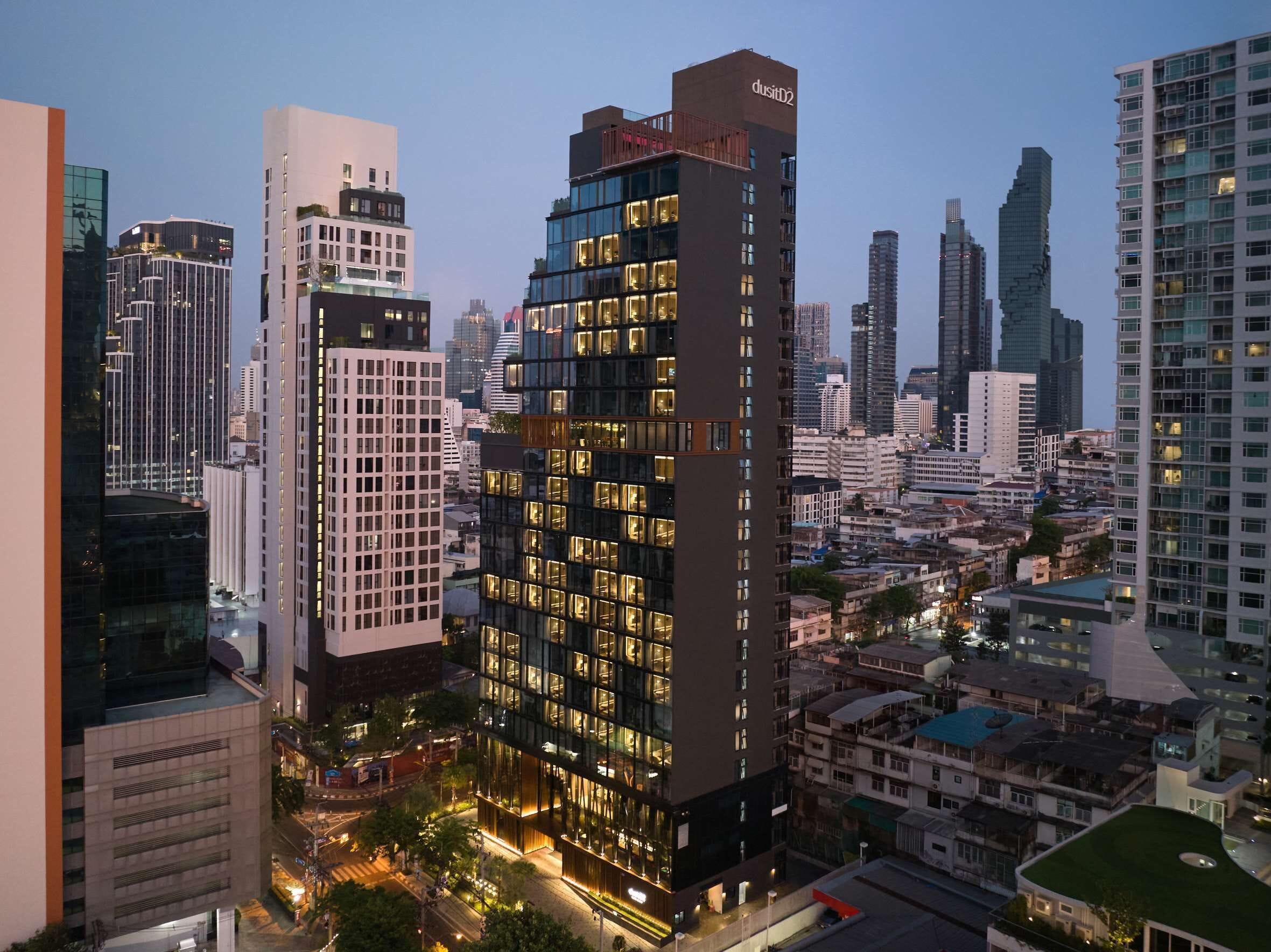 A high-rise building with multiple floors, large windows, and a modern architectural design.