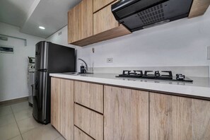 Fridge, microwave, stovetop, coffee/tea maker