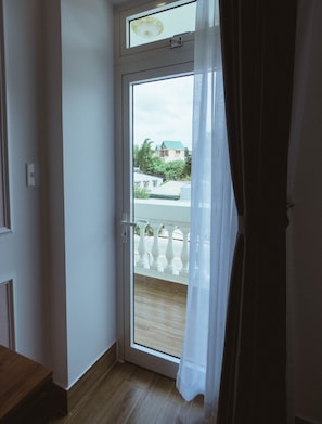 Premium Room, 2 Queen Beds, Balcony, City View | Free minibar items, in-room safe, desk, laptop workspace