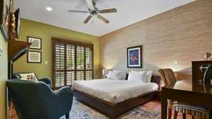 A bedroom with a bed, a desk, a chair, a ceiling fan, and a window with a view. - Rooftop Hot Tub After the Slopes (Park City)