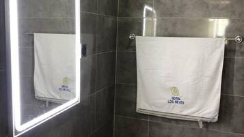 Hydromassage showerhead, free toiletries, bathrobes, toilet paper