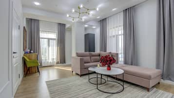 Deluxe Double Room | Living area | Flat-screen TV