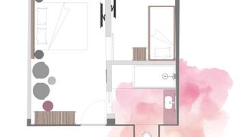 Plano de planta de una habitación de hotel con cama, baño, una pequeña zona de estar y kitchenette.