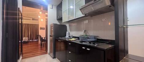 Fridge, microwave, electric kettle, cookware/dishes/utensils