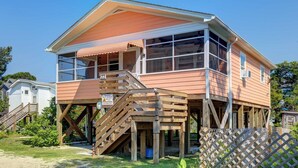 A two-story house with a wooden deck and a covered porch. - Latitude Adjustment - Ocracoke Island (Ocracoke)