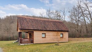 A small wooden cabin with a tiled roof, a porch, and a grassy area in front. - 3 bedroom lovely home in Sainte Croix-Volvestre (Sainte Croix-Volvestre)