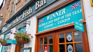 A building with a sign reading "Anstruther Fish Bar" and another sign stating "Winner UK Fish & Chip Shop of the Year 2009". - Jules By The Sea Anstruther (Anstruther)