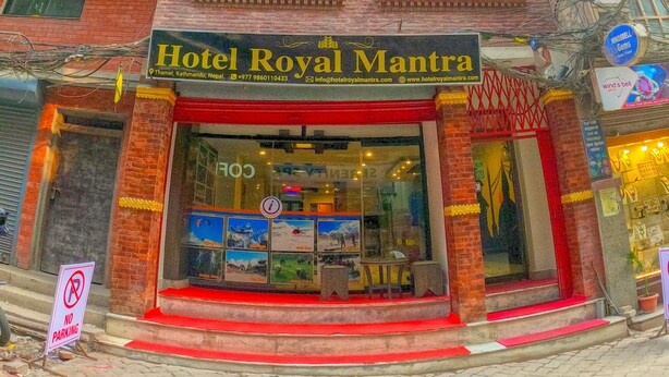 A multi-story building with a sign for "Hotel Royal Mantra" at the ground level. - Hotel Royal Mantra (Kathmandu)