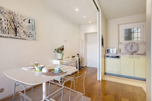 A modern kitchen with a microwave, sink, and cabinets.