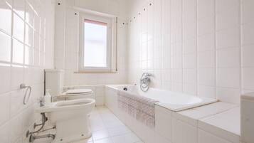 Bathtub, hair dryer, towels