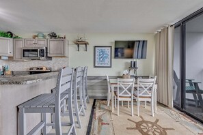 Condo, 2 Bedrooms | Dining - 0312 Captains Quarters by Atlantic Towers (Carolina Beach)