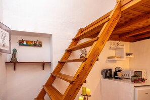 Kallisti Apartment | Living area | 32-inch flat-screen TV with cable channels, TV - Villa Sertis Santorini (Santorini)