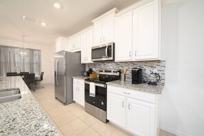 Enjoy meals in the kitchen with a dining area nearby.