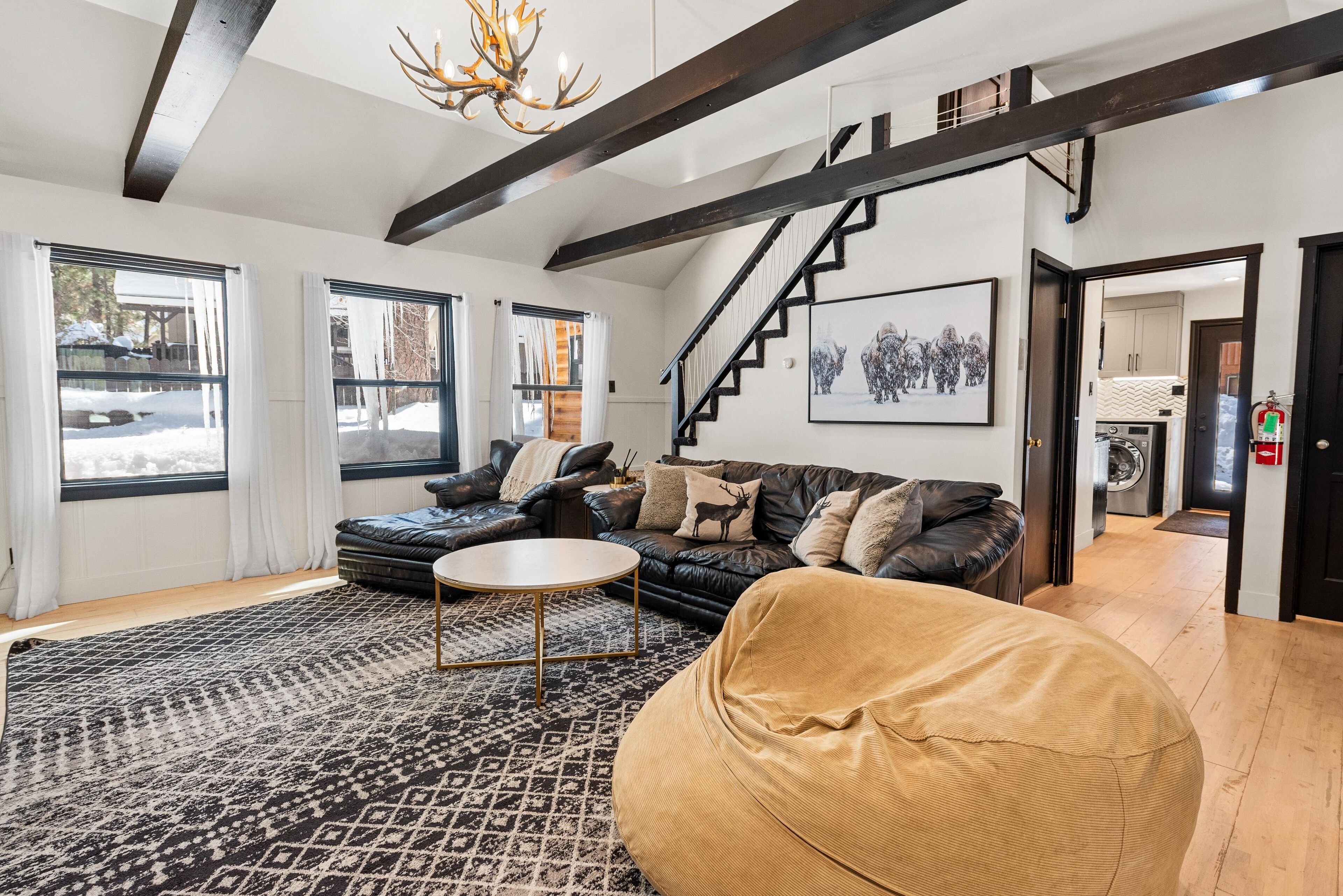 Nostalgic vibe with modern amenities in midcentury log cabin with hot tub + more